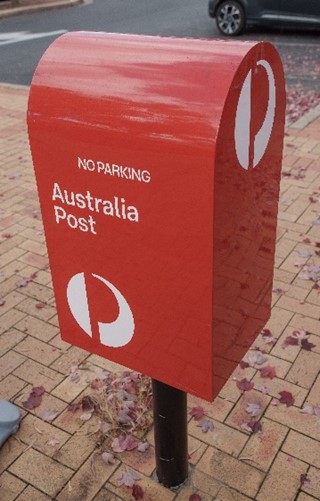 Red post box.