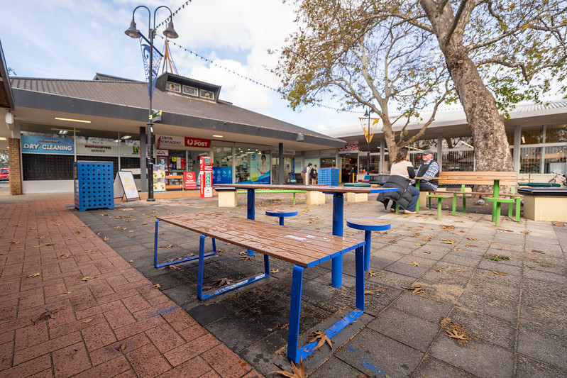 A courtyard with tables and seating.