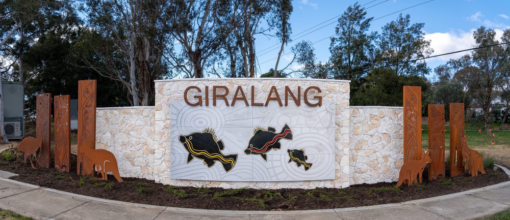 Artwork featuring "Giralang" and fish.